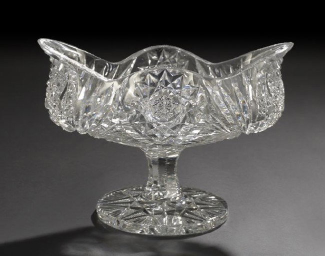 Pairpoint Brilliant-Cut Glass Footed Oranges Bowl: Rare Pairpoint Brilliant-Cut Glass Footed Oranges Bowl, first quarter 20th century, of ovoid form in an opulent hobstar, fan and cane "bowtie" decor, the circular foot reverse cut in a "snowflake"-cen