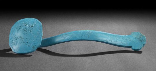 Chinese Turquoise Ruyi Scepter: Chinese Turquoise Ruyi Scepter, 20th century, carved of reconstituted turquoise in the traditional shape with low-relief designs of peony, rockwork and a bat on the head, flowering orchids and ling ch