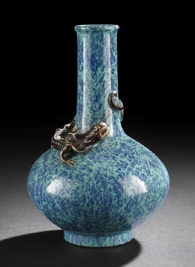 Chinese Molded Porcelain Bottle Vase: Chinese Molded Porcelain Bottle Vase, 20th century, the bulbous body with elongated neck with the figure of a single horned dragon wrapped around the neck, the body glazed in "Robin's Egg" blue, the d