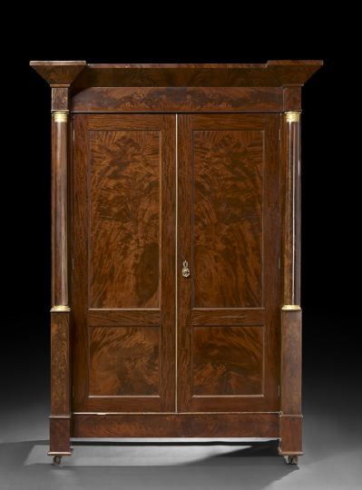 American Late Classical Mahogany Armoire: Fine American Late Classical Brass- and Ormolu-Mounted Mahogany Armoire, second quarter 19th century, School of Duncan Phyfe, the projecting cornice over a pair of bisected paneled doors with a brass
