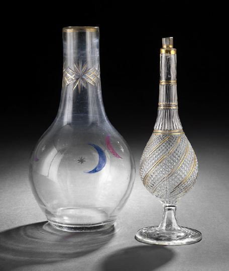 Two Pieces of Middle Eastern Glassware: Two Pieces of Middle Eastern Glassware, including a first quarter 19th-century mold-blown rosewater bottle, the ovoid body with spiraling "beading" below a tall, gadrooned neck, decorated with gilt th