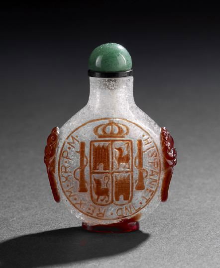 Good Chinese Overlay Glass Snuff Bottle: Good Chinese Overlay Glass Snuff Bottle, overlaid in red on snowflake glass, carved on each side as a Spanish coin of King Charles IV, the sides with mock ring handles, with an aventurine stopper, h. 