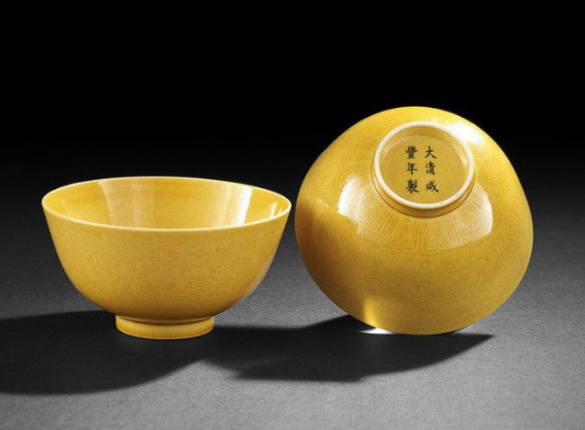 Pair of Chinese "Imperial Yellow" Porcelain Bowls: Fine Pair of Chinese "Imperial Yellow" Porcelain Small Bowls, Republic Period (1912-1949), each thinly potted and delicately engraved with dragons and phoenixes among clouds above a sectioned border o