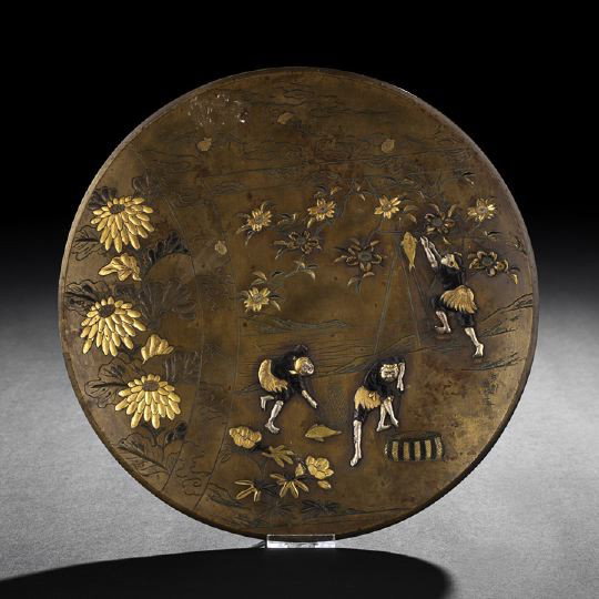 Japanese Multi-Metal Wall Plaque: Japanese Multi-Metal Wall Plaque, first half 20th century, of circular outline with engraved design of a seaside scene within a folder against a ground of bats, clouds and flowers, the scene with appl