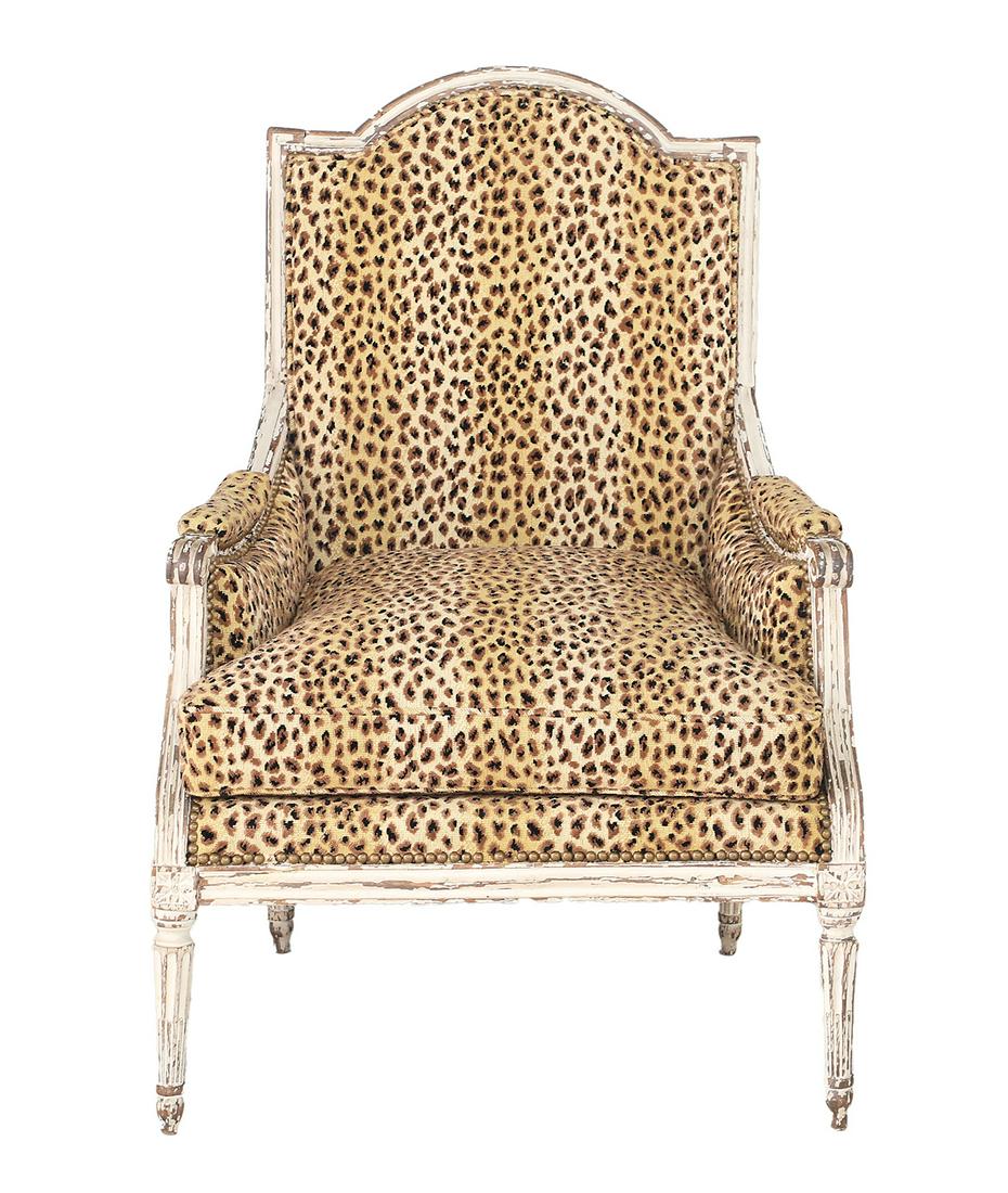 Louis XVI-Style Creme-Peinte Bergere: Louis XVI-Style Creme-Peinte Bergere 19th century, the padded back surmounted by a domed and molded crest, joined by padded scrolling arms to the cushioned seat, raised on stop-fluted, tapering circul