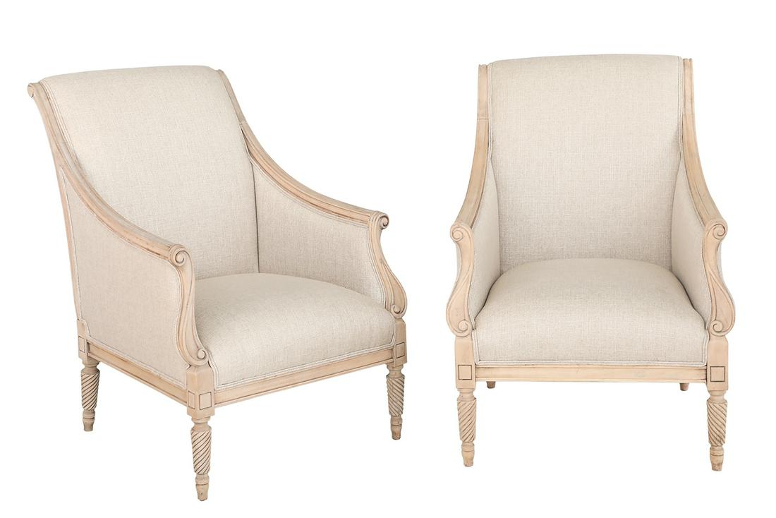 Pair of Louis XVI-Style Pickled Wood Bergeres: Pair of Louis XVI-Style Pickled Wood Bergeres each with a padded back-scrolled back joined by downswept closed arms to the padded seat, raised on spiral-fluted tapering circular legs ending in toupie 