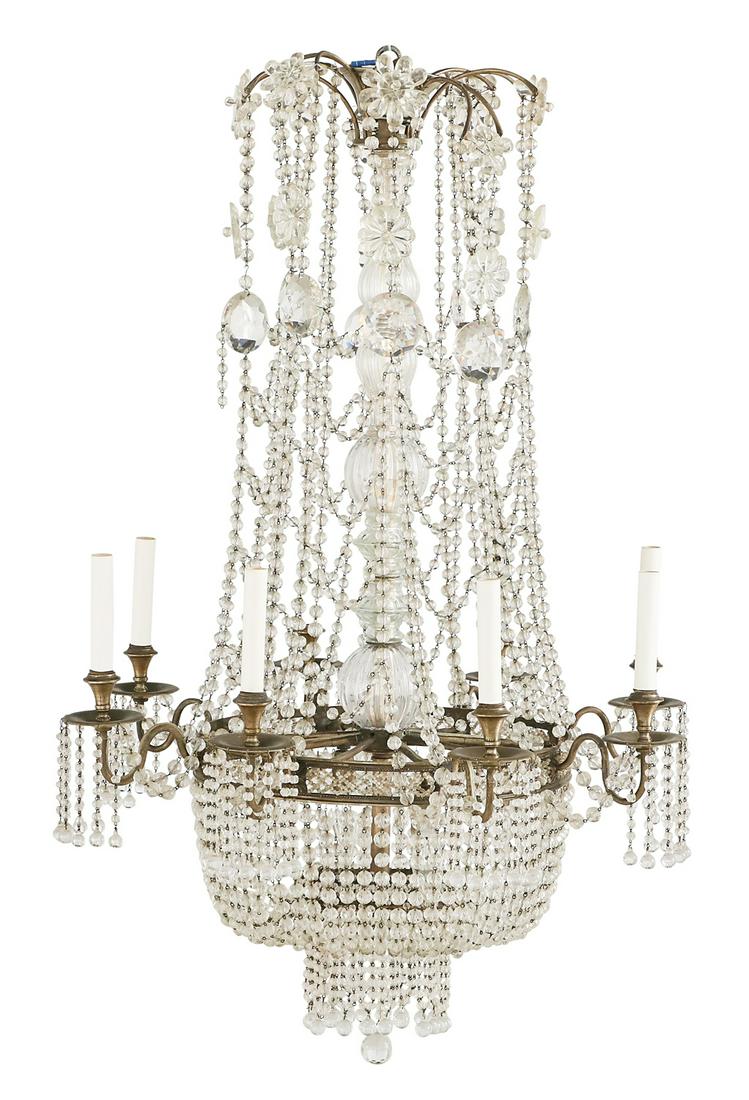 Empire-Style Crystal and Bronze Chandelier: Empire-Style Crystal and Patinated-Bronze Chandelier early 20th century, of basket form, the central shaft with reeded, tubular glass fittings, the body dressed with strands of crystal chains and rose