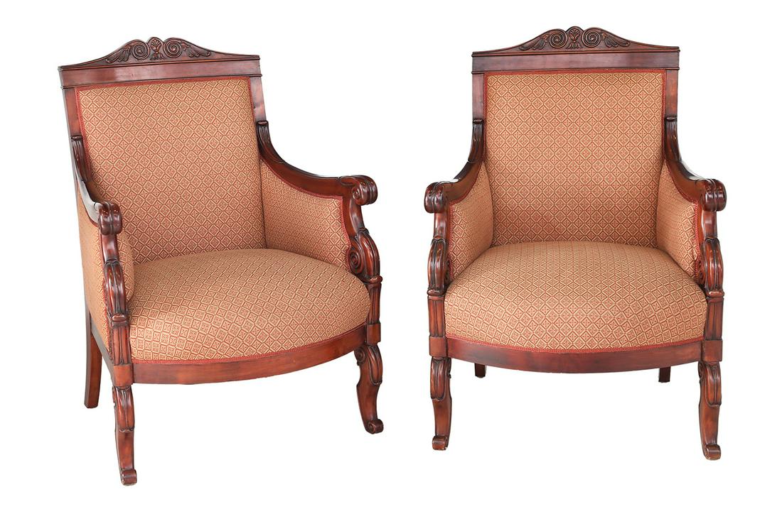 Pair of Restauration Mahogany Bergeres: Pair of Restauration Mahogany Bergeres 19th century, each with a padded back surmounted by a scrolling foliate triangular crest, joined by closed scrolling arms to the padded seat, raised on shaped le
