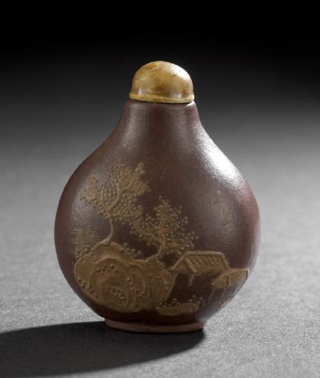 Chinese Slip Decorated Zisha Clay Snuff Bottle: Chinese Slip Decorated Zisha Clay Snuff Bottle, of flattened pear shape, the brown body with ochre colored slip decoration of two pavilions by a rocky outcrop with trees on one side and a pavilion by 