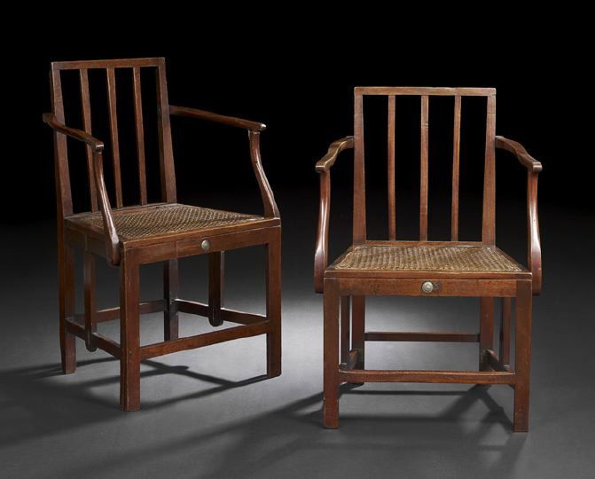 Rare Pair of Victorian Campaign Armchairs: Rare Pair of Victorian Campaign Armchairs, mid-19th century, each with a slatted back joined to the caned seat by shaped arms, raised on square legs joined by a box stretcher, the whole hinged and wit