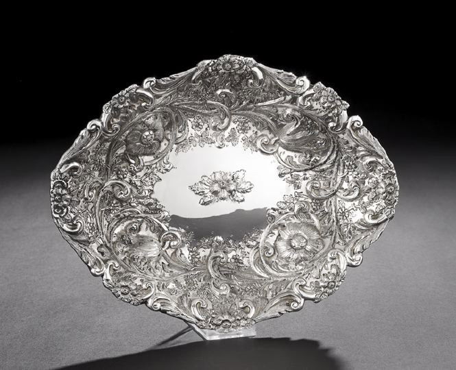 Victorian Sterling Silver Sweetmeat Dish: Victorian Sterling Silver Sweetmeat Dish, hallmarked London, 1890-1891, by Charles Stuart Harris, of navette form with convex bottom. decorated with a wide intricate band of repousse and chased rococo