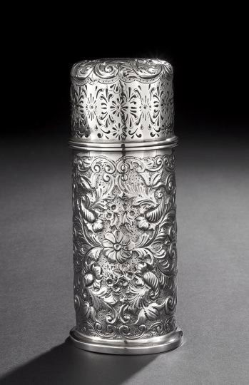 Edwardian Sterling Silver Caster: Edwardian Sterling Silver Caster, hallmarked London 1901-1902, by Mappin & Webb, of cylindrical form, decorated all over with repousse rococco scrolls and flowers on a pelleted ground, the pierced cap
