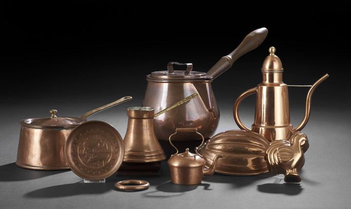 Group of Nine Decorative Copper Pieces: Group of Nine Decorative Copper Pieces, consisting of two covered pots, a small brass-handled pouring vessel, miniature tea kettle, coffee pot, two moulds, a decorative plaque and a ring, h. 2-1/2" to