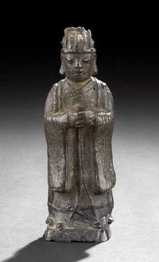 Chinese Cast Iron Figure of a Court Official: Chinese Cast Iron Figure of a Court Official, 19th century, the standing robed figure with official cap and clasped hands executed in the Ming dynasty style, h. 6-3/4". Provenance: ex. coll. Henry Ste