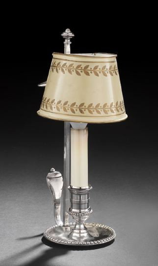 Edwardian Silverplate Lamp: Edwardian Silverplate Lamp, early 20th century, in the form of a chamberstick, fitted with a cream and parcel-gilt demi-lune tole adjustable shade, h. 10-1/2".