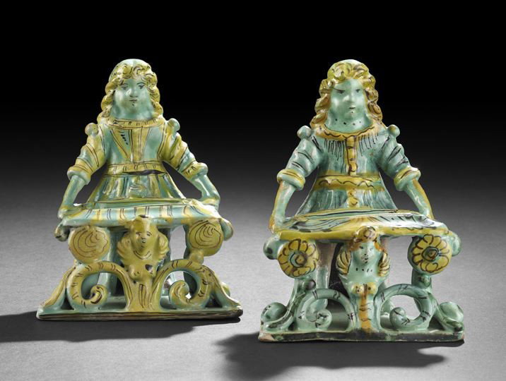 Pair of Faience Continental Salt Cellars: Pair of Faience Continental Salt Cellars, first quarter 19th century, in the form of maidens carrying serving trays, each tray supported by baroque scrolls and female figure, h. 6-1/2", w. 5", d. 4-3/