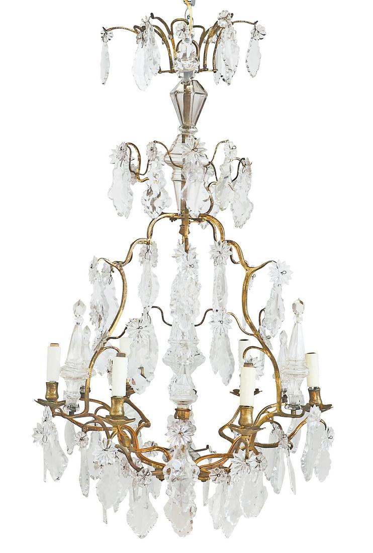 French Gilt-Bronze and Crystal Chandelier: French Gilt-Bronze and Crystal Chandelier third quarter 20th century, of baroque inspiration, the six-light chandelier set with a standard clad with cut glass and six scrolled candle arms with turned 