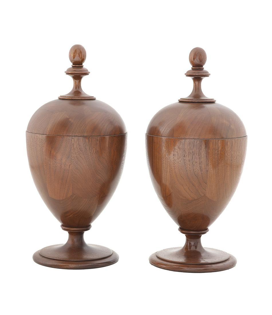 Pair of Laminated Mahogany Knife Urns: Pair of Laminated Mahogany Knife Urns 20th century, the oeuf-form urns supported on turned bases and set with turned knobs, the interiors with pierced fittings. h. 21-1/4", dia. 8-3/4"