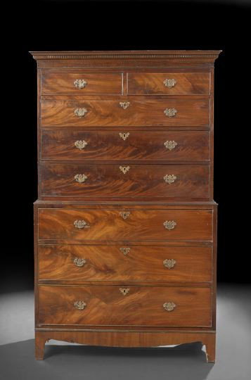 George III Mahogany Chest-on-Chest,: George III Mahogany Chest-on-Chest, early 19th century and later, the molded and dentillated cornice above a case fitted with two small drawers over three long graduated drawers, the lower section fit