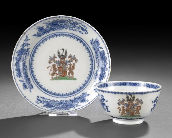 Chinese Export Armorial Tea Bowl and Saucer: Chinese Export Porcelain Armorial Tea Bowl and Saucer, composed of a handle-less tea cup and conforming saucer, each decorated in underglaze blue with a heraldic device in polychrome enamels in the ce