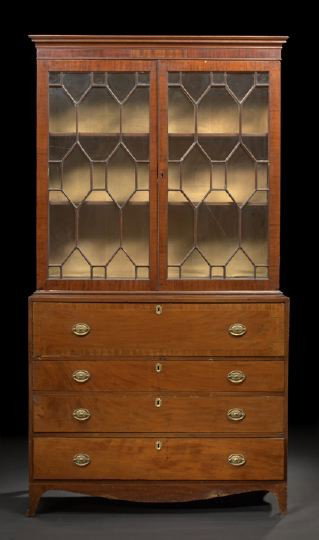 George III Mahogany Bookcase,: George III Mahogany Bookcase, early 19th century, the molded cornice above two astragal-glazed doors, the lower section fitted with a deep drawer over three graduated long drawers, raised on splayed b