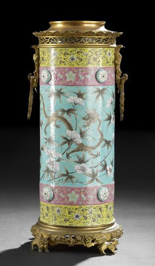 Chinese Famille Rose Molded Umbrella Stand: Chinese Famille Rose Molded Porcelain Umbrella Stand with Continental Mounts, of cylindrical form with molded porcelain bosses, enameled in famille rose enamels with a central band of dragons among fl