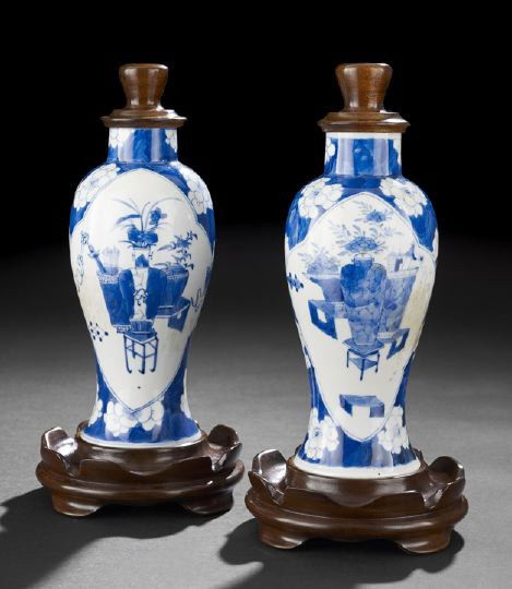 Pair Chinese Blue and White Baluster Vases,: Pair Chinese Blue and White Baluster Vases, each decorated in underglaze blue with reserve panels of Chinese antiques against a hawthorne-patterned ground, custom wooden bases and tops by Dennis Poupa
