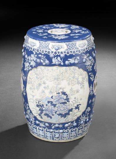 Chinese Blue and White Porcelain Garden Seat: Chinese Blue and White Porcelain Glazed Garden Seat, of barrel-form with molded bosses and pierced cash symbols, glazed in underglaze blue and white and overglaze white with overall floral decoration,