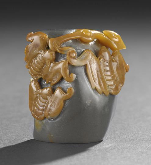 Unusual Chinese Two-Color Agate Seal,: Unusual Chinese Two-Color Agate Seal, in the form of a dark green flattened agate pebble with ochre skin at the front carved in relief as three bats and a ruyi scepter, the base uncarved, h. 2-1/8".