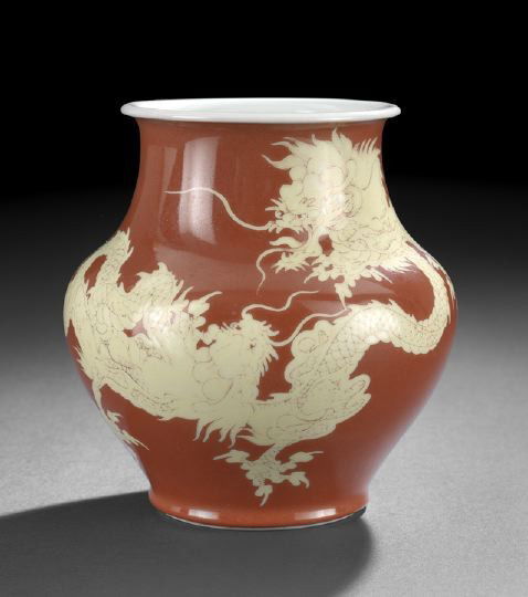 Japanese Ovoid Porcelain Vase,: Japanese Ovoid Porcelain Vase, the compressed body with flared lip, glazed in yellow with two sinuous dragons against an iron-red ground, the base with underglaze blue seal of Makuzu-Kozan, h. 6-3/4".