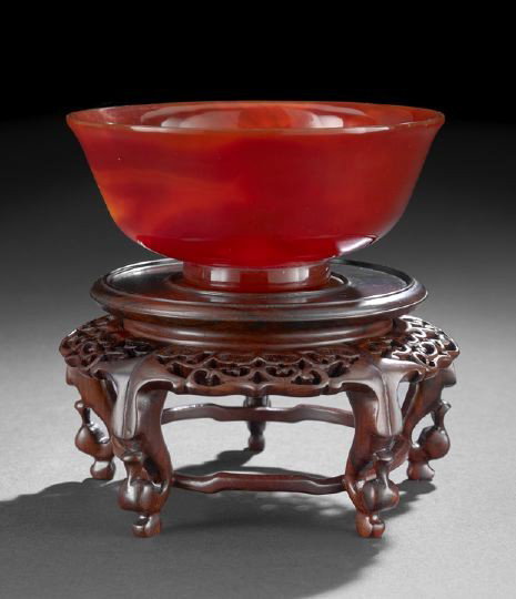 Fine Chinese Carved Carnelian Bowl,: Fine Chinese Carved Carnelian Bowl, of circular-form with slightly everted lip rim and resting on a straight foot, the stone of rich, intense color and beautifully polished, carved wooden stand, dia. 