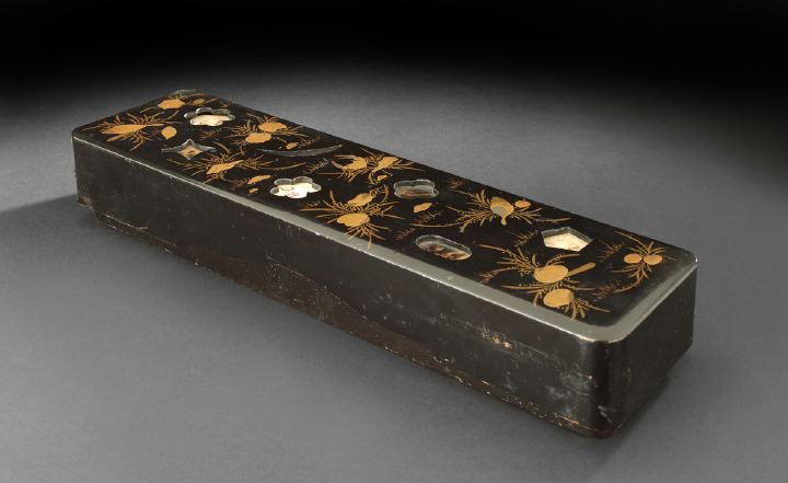 Unusual Japanese Lacquer Document Box,: Unusual Japanese Lacquer Document Box, Meiji Period (1868-1912), the rectangular box lacquered in black, the cover with gold lacquer decoration of seashells and seaweed and recessed, shaped, pierced o