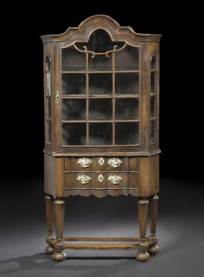 Dutch Oak Vitrine Cabinet,: Dutch Oak Vitrine Cabinet, third quarter 19th century, the domed and molded cornice above an astragal-glazed door, the sides also glazed, the lower section fitted with two shaped drawers, raised on pa