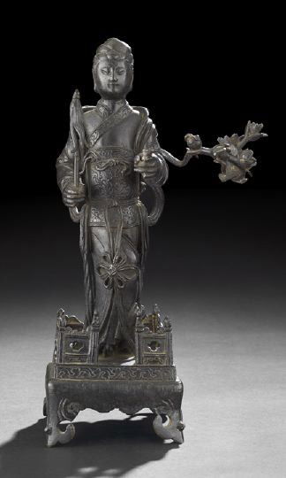 Chinese Cast-Bronze Figure of a Court Dancer,: Chinese Cast-Bronze Figure of a Court Dancer, 18th/19th century, the well cast figure of a standing female dancer clad in loose robes holding a fly whisk in one hand and a floral spray in the other, s