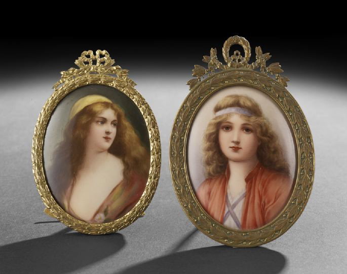 Two Framed German Porcelain Portrait Plaques: Two Small Framed German Porcelain Portrait Plaques, first quarter 20th century, the first example of a maiden with long flowing hair, signed: "Wagner", the back with impressed: "_ R" within a circle a