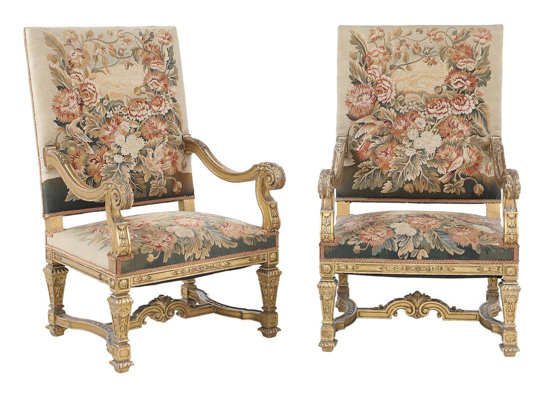 Pair of Large Louis XIV-Style Giltwood Fauteuils: Pair of Large Louis XIV-Style Giltwood Fauteuils 19th century, each with a padded rectangular back joined by fluted, downswept arms to scrolling foliate-carved hand rests, the padded seats raised on p