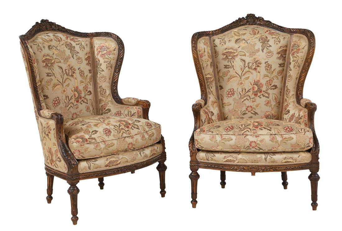 Pair of Louis XVI-Style Bergeres avec Oreilles: Pair of Louis XVI-Style Walnut Bergeres avec Oreilles late 19th century, each with a padded and domed back surmounted by a floral basket crest, joined by shaped and padded sides and padded arms to the