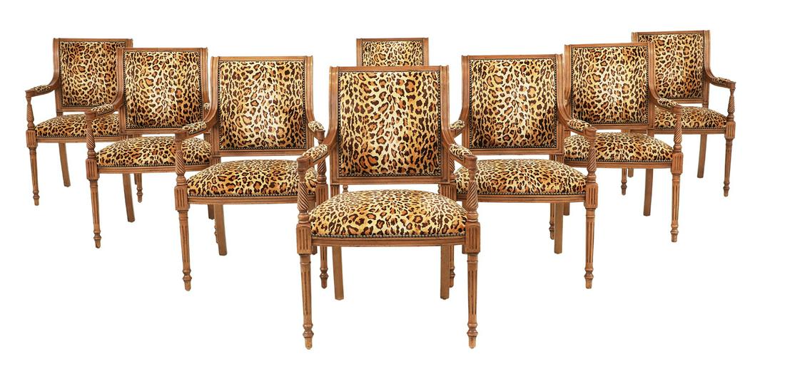 Suite of Eight Fruitwood Armchairs: Suite of Eight Fruitwood Armchairs in the Directoire taste, each with a backswept crest above a padded back, joined to the padded seat by like arms on spiral-ribbed uprights, raised on fluted, taperin