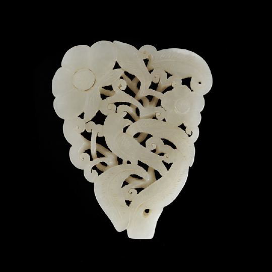 Chinese Carved White Jade Pendant: Chinese Carved White Jade Pendant, first half 20th century, of triangular outline carved and pierced as a bird nesting among foliage and flowers, h. 3-1/8", w. 2-1/2".