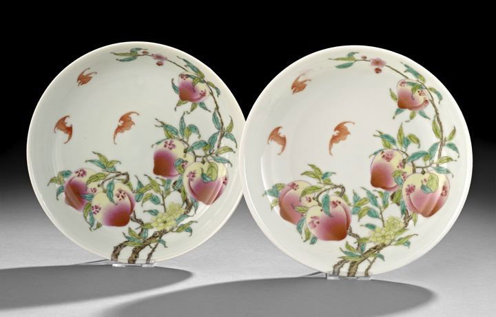 Pair Chinese Famille Rose Saucer Dishes: Pair Chinese Famille Rose Saucer Dishes, 20th century, each enameled on a white ground with a leafy branch with flowers, five peaches and three bats in flight, the exterior with similar decoration, th
