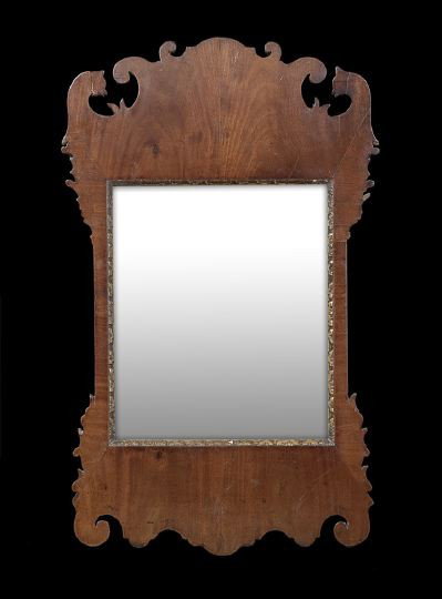 George III Mahogany Looking Glass: George III Mahogany Looking Glass, fourth quarter 18th century, in the Chippendale taste, with an old mirror plate and parcel-gilt liner, h. 37-1/2", w. 23".