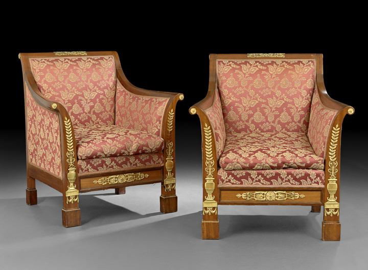 Pair of Empire-Style Mahogany Arm Chairs: Pair of Empire-Style Gilt-Metal-Mounted Mahogany Arm Chairs, early 20th century, each of generous proportions, the back centered by an ormolu mount, and joined to upswept armrests on scroll supports,