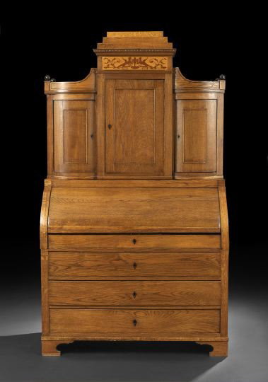 Biedermeier Oak Secretary: Biedermeier Oak Secretary, mid-19th century, the central stepped plinth above a griffin-and-urn-inlaid frieze, over a paneled cupboard door, flanked to either side by a slightly-bowed and paneled cupb