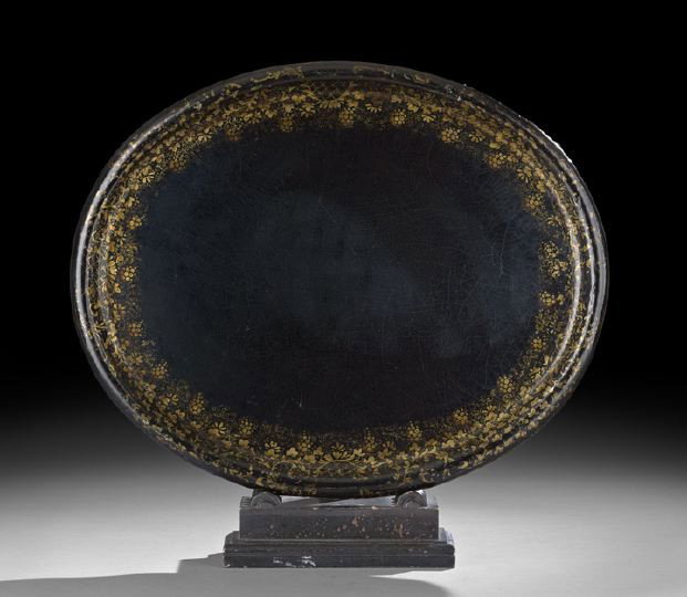 Regency Ebonized Papier Mache Tray: Regency Ebonized Papier Mache Tray, first quarter 19th century, of ovoid-form, the edge raised and with an elaborately patterned grapevine border, w. 32", d. 25-1/2".