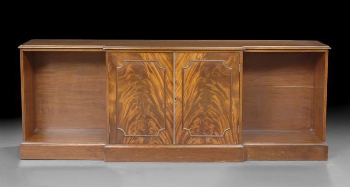 Regency-Style Mahogany Credenza: Regency-Style Mahogany Credenza, first half 20th century, having a pair of figured mahogany cabinet doors in the center and flanked by recessed open-shelf cavities (shelves lacking), h. 31", w. 83", d