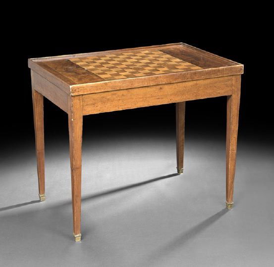 Provincial Walnut Games Table: Provincial Walnut Games Table, early 19th century, in the Louis XVI-style, the rectangular dished top with an inlaid gaming board, removing and flipping to a padded fabric panel, the interior fitted w