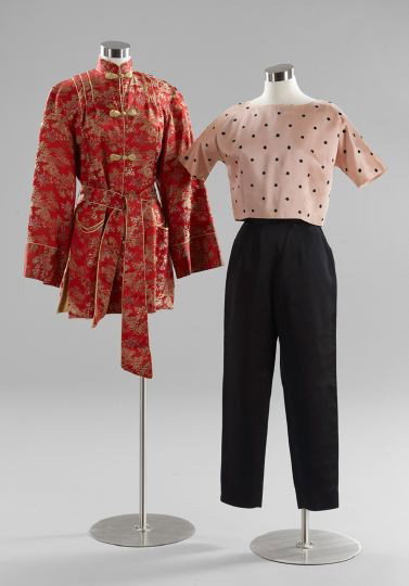 Three-Piece Group of Vintage Clothing: Three-Piece Group of Vintage Clothing, ca 1950, consisting of a red satin brocade smoking jacket with sash, the jacket with shoulder darts and front semi-circular raced pockets, five gold satin elabor