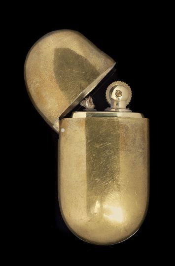 Brass Elsa Peretti Tiffany Cigarette Lighter: Brass Elsa Peretti For Tiffany, New York, Cigarette Lighter, 1982, presented in a blue Tiffany drawstring pouch, h. 2-1/2".