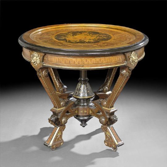 American Neo-Grec Rosewood Center Table: American Neo-Grec Parcel-Gilt, Ebonized, Marquetry Inlaid and Rosewood Center Table, third quarter 19th century, probably Pottier and Stymus, New York, the circular top with inlay depicting musical tr