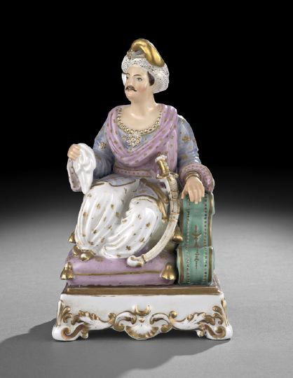 Old Paris Porcelain "Pasha" Perfume Bottle: Old Paris Porcelain "Pasha" Perfume Bottle, second quarter 19th century, attributed to Jacob Petit, shown seated on a tasseled cushion, his scimitar at his side, wearing a beaded necklace and decorate